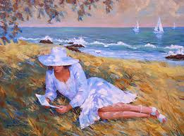 donna che legge a mare