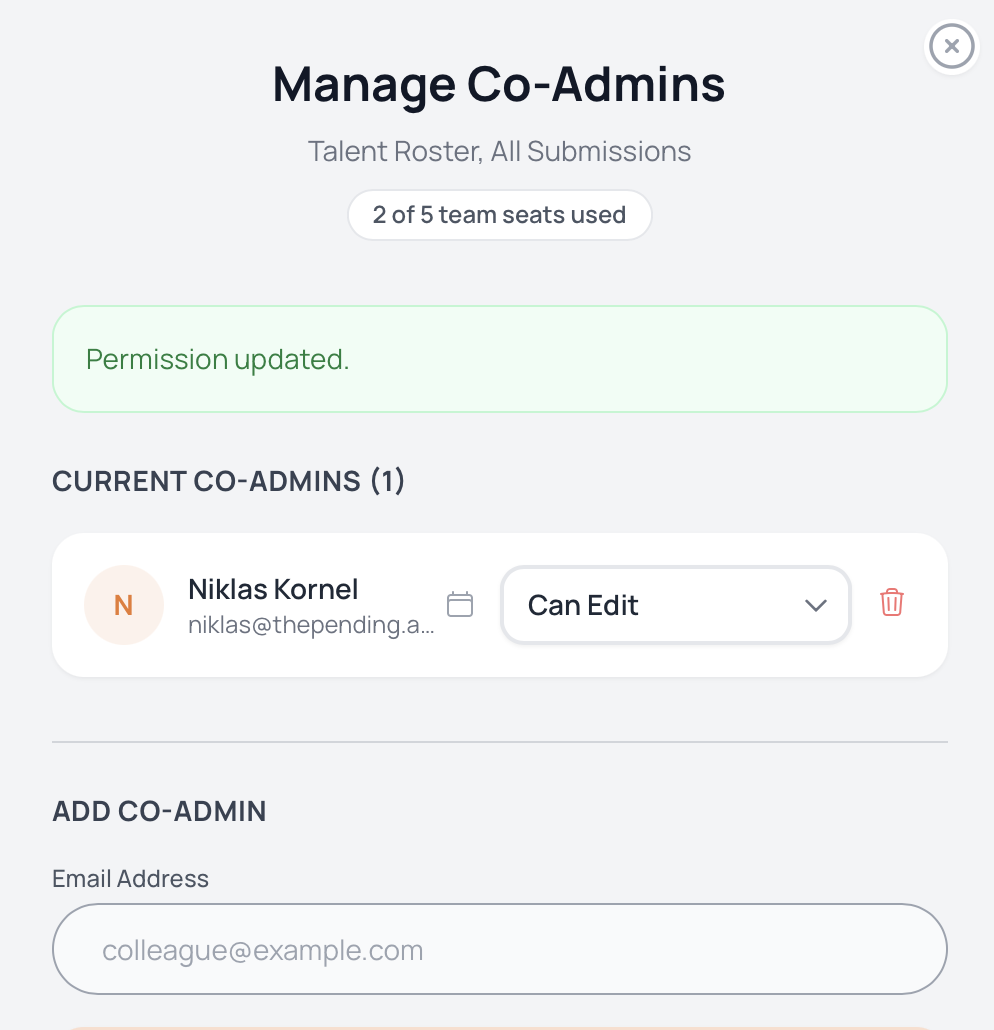 Screenshot of The Pending's Co-Admin management panel showing team seats, permission levels, and invite-by-email.