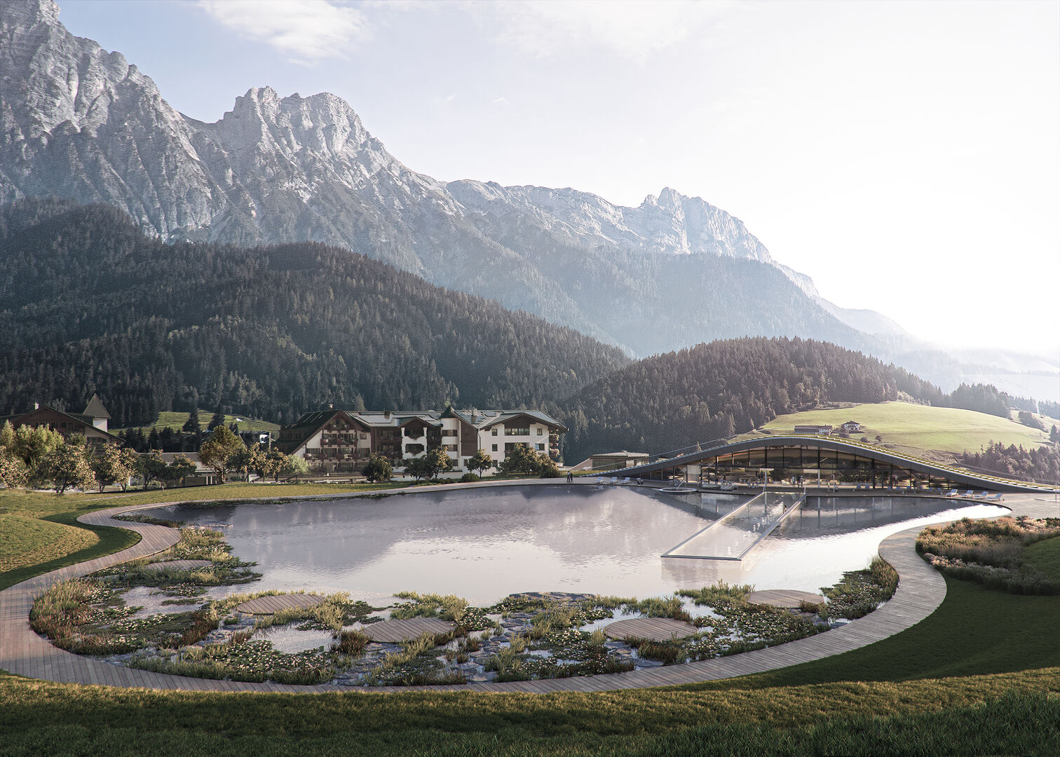 Blick von oben: See, darin der Infitiypool, dahinter das Spagebäude