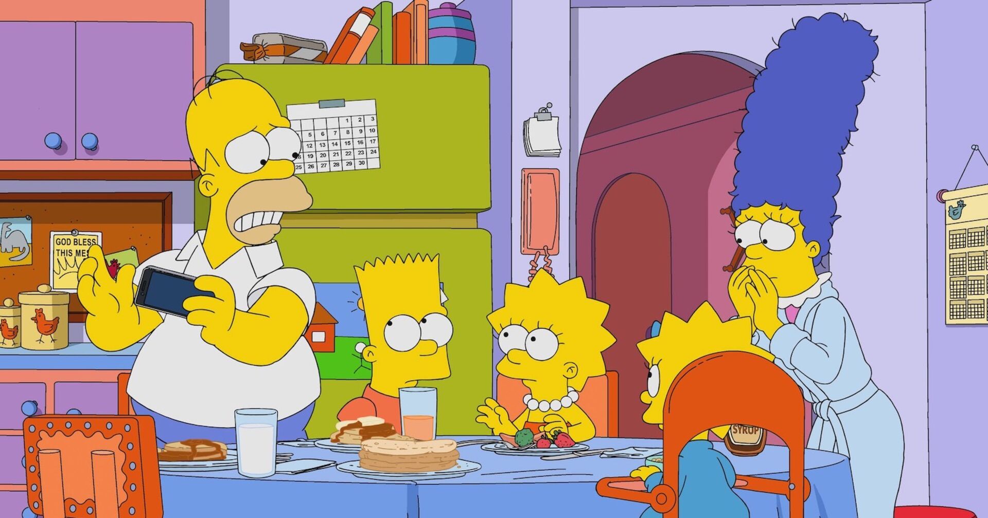 Die Simpsons-Familie nimmt ihr Frühstück in der Küche ein