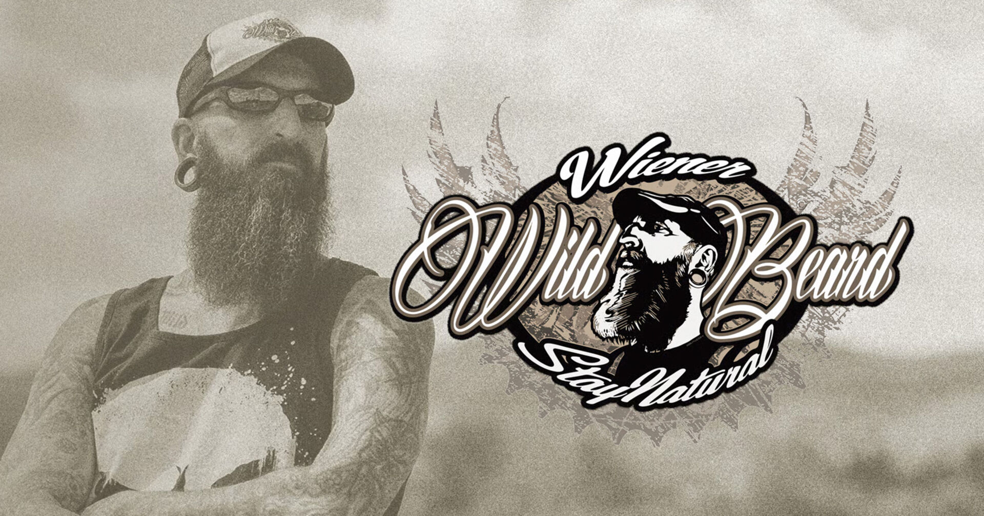 Vollbärtiger Mann mit ärmellosem Shirt und Sonnenbrille | Credit: Wiener Wild Beard