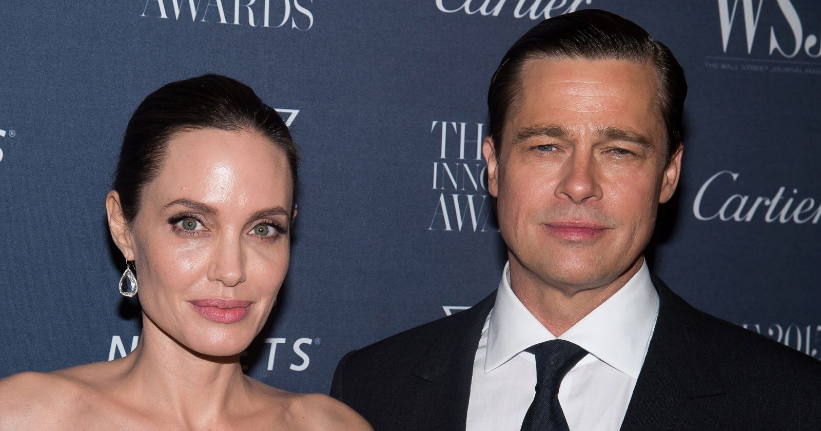 Angelina Jolie Pitt und Brad Pitt lächeln