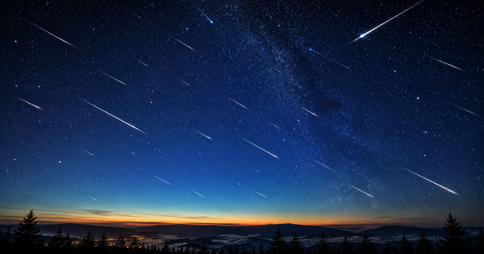 Sternschnuppen am klaren Nachthimmel über einer Landschaft während des Meteorstroms der Eta-Aquariiden im Mai