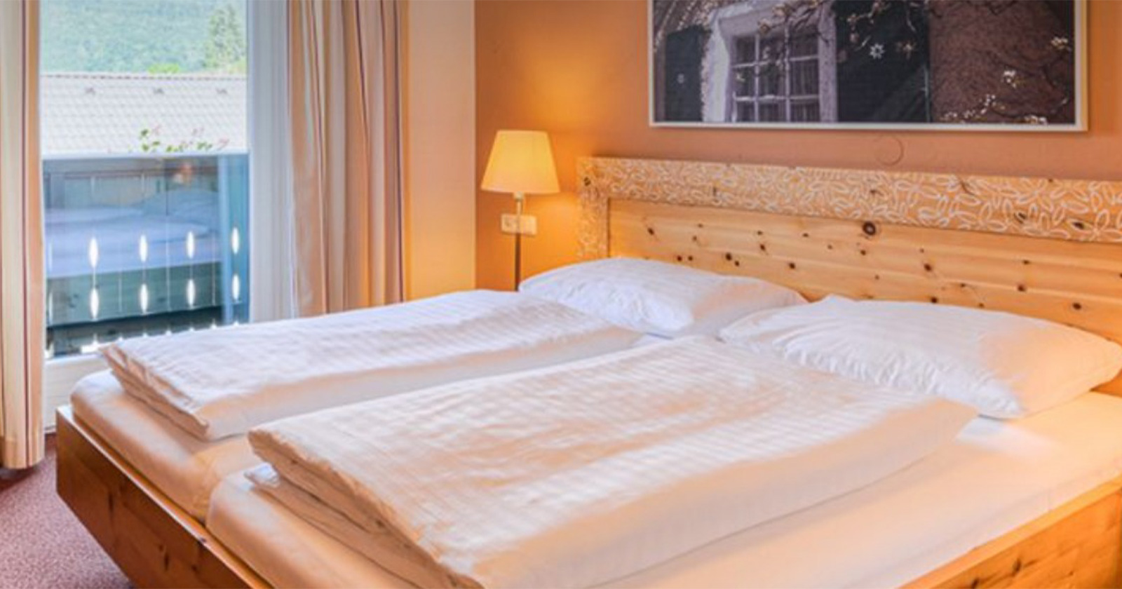 Schlafzimmer in einem Chalet | Credit: TVB Kuchl