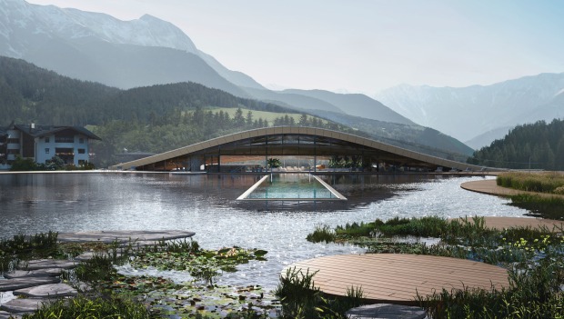 Ein See, darin liegt ein Infitnitypool, dahinter der Spe-Bereich