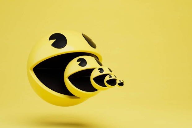 Spielfigur "Pac-Man" auf gelben Hintergrund