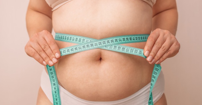Frau mit dickem Bauch und Maßband. | Credit: iStock.com/Irina Shatilova