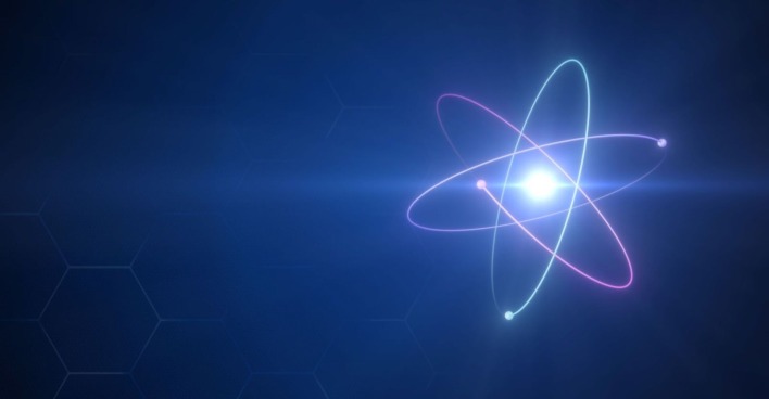 Schematische Darstellung eines Atoms mit darum herumsausenden Elektronen