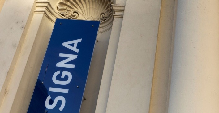 Logo der Signa an einer Wand.
