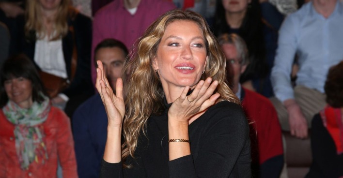 Gisele Bündchen schaut überrascht.