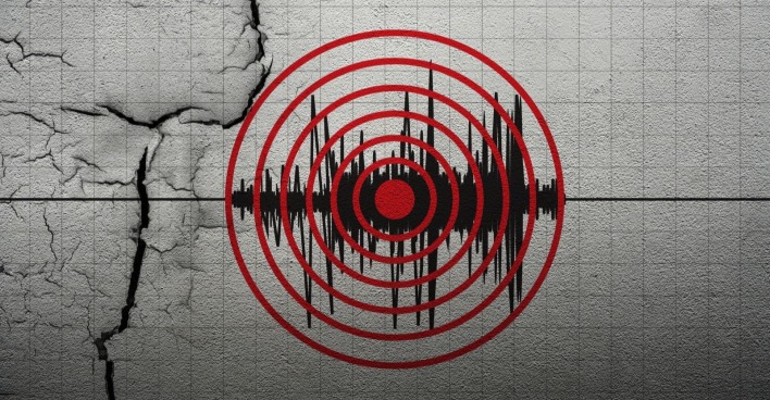 Grafische Darstellung seismischer Wellen mit roten Kreisen und Rissmuster – Symbolbild für ein Erdbeben in Italien.