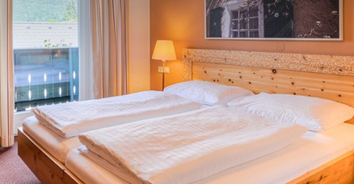 Schlafzimmer in einem Chalet | Credit: TVB Kuchl