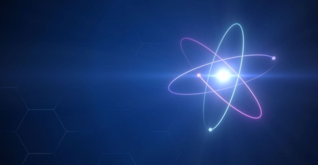 Schematische Darstellung eines Atoms mit darum herumsausenden Elektronen