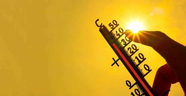 Thermometer und Sonne.
