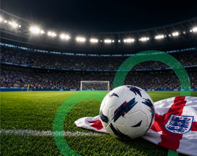 Soccer ball placed on the England flag inside a floodlit football stadium for England World Cup 2026 schedule banner