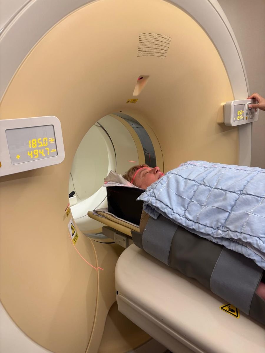 Patient undergoing CT scan at JIAN Health Promotion Center for diagnostic imaging procedure