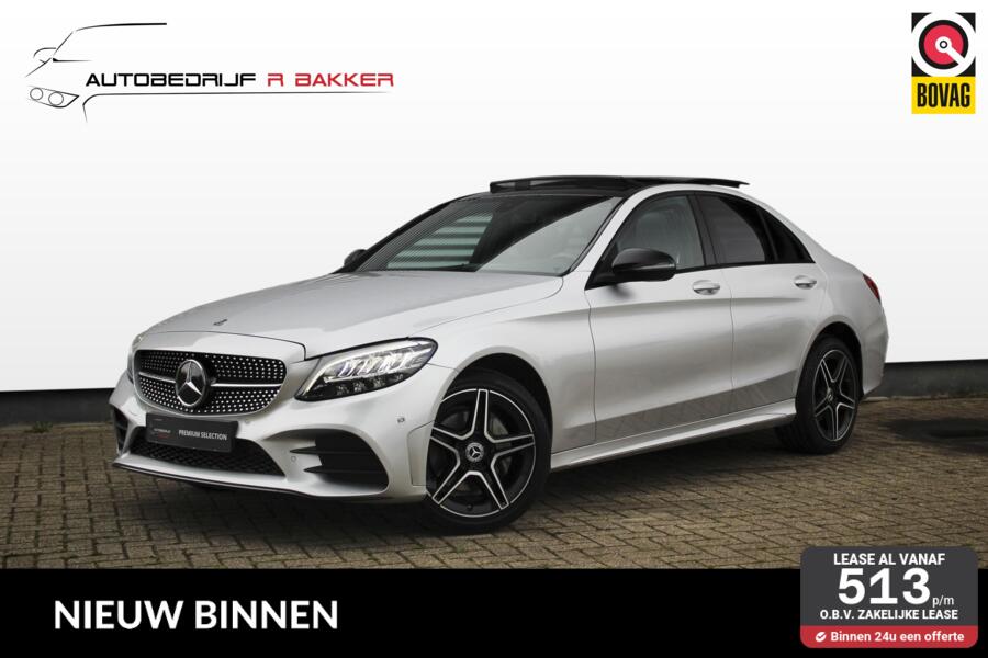 Mercedes C-klasse 200 4MATIC Premium AMG Line // Panoramadak | Night Pack | Memory stoelen | Sfeerverlichting | Analoge klok | CarPlay & Android Auto