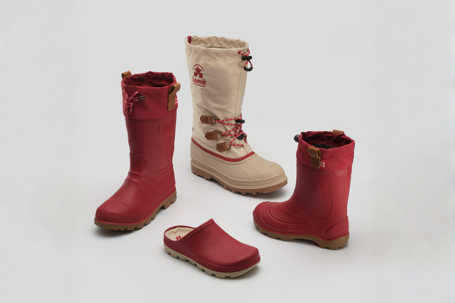 Assortment of red and beige winter boots and clogs by Kamik