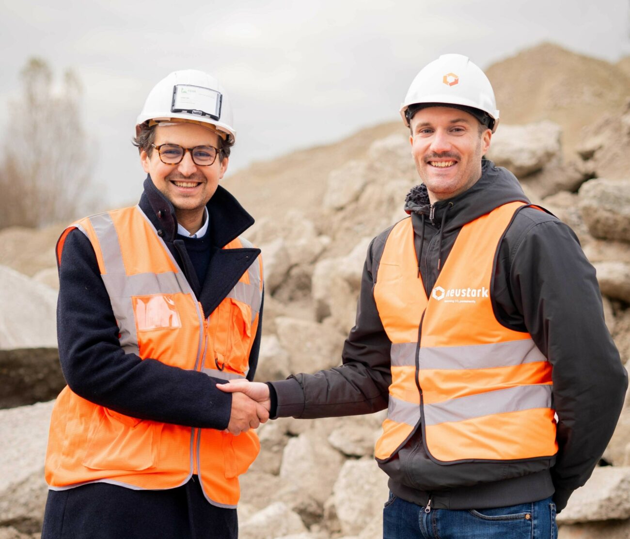 Neustark and Fehr shake hands
