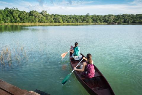 Kayaking in calm blue river