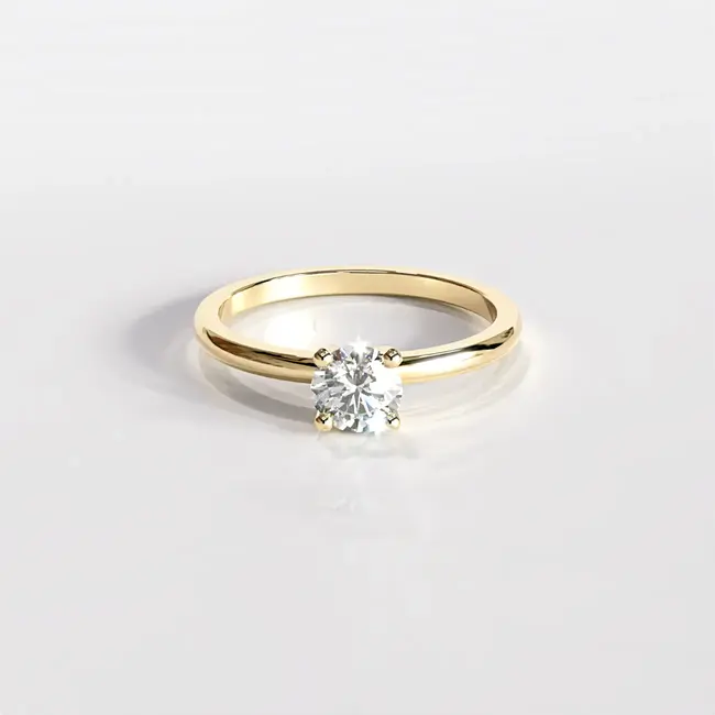 Verlovingsring met minimalistische ronde diamant van 0,5 karaat, geelgouden zetting.