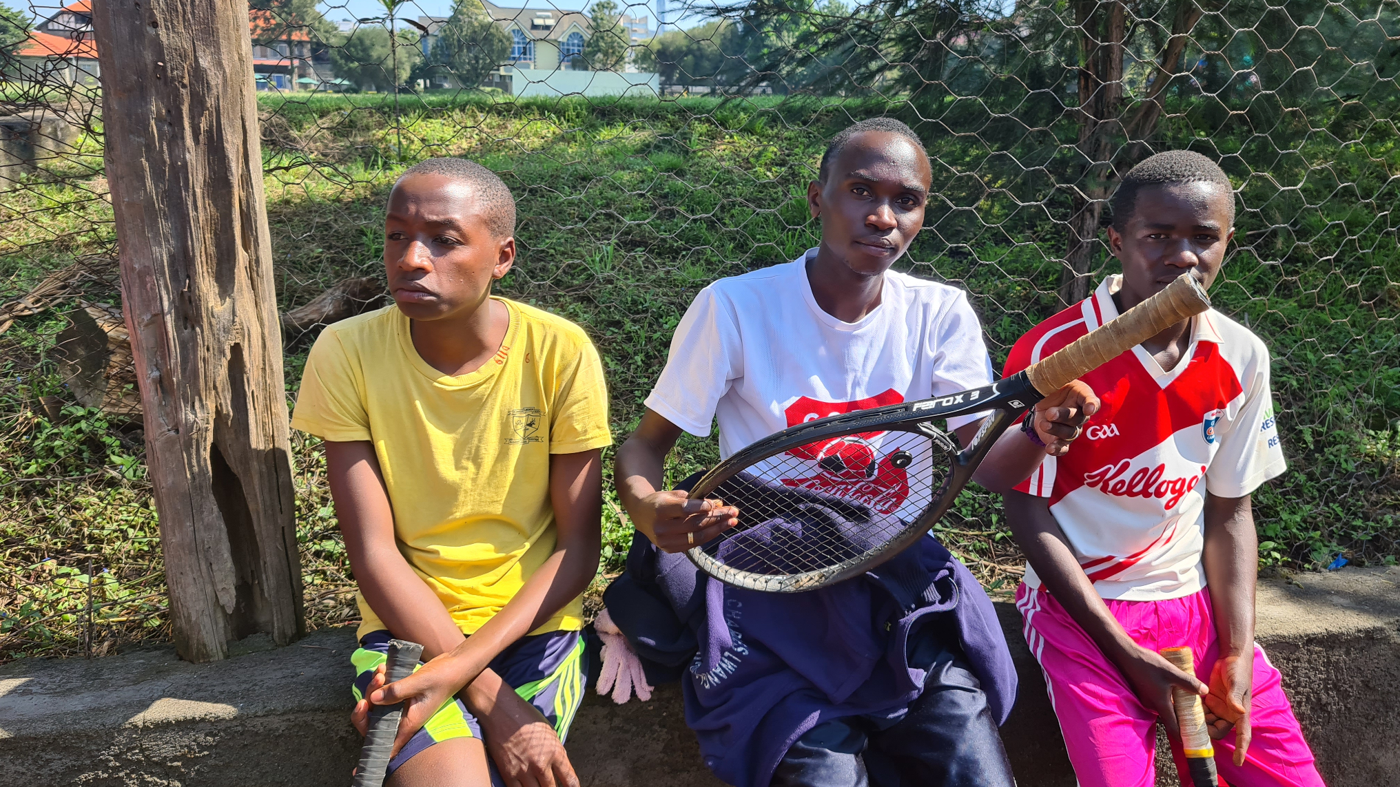 Francis Kimanzi (centre) poses for a photo with his teammates.