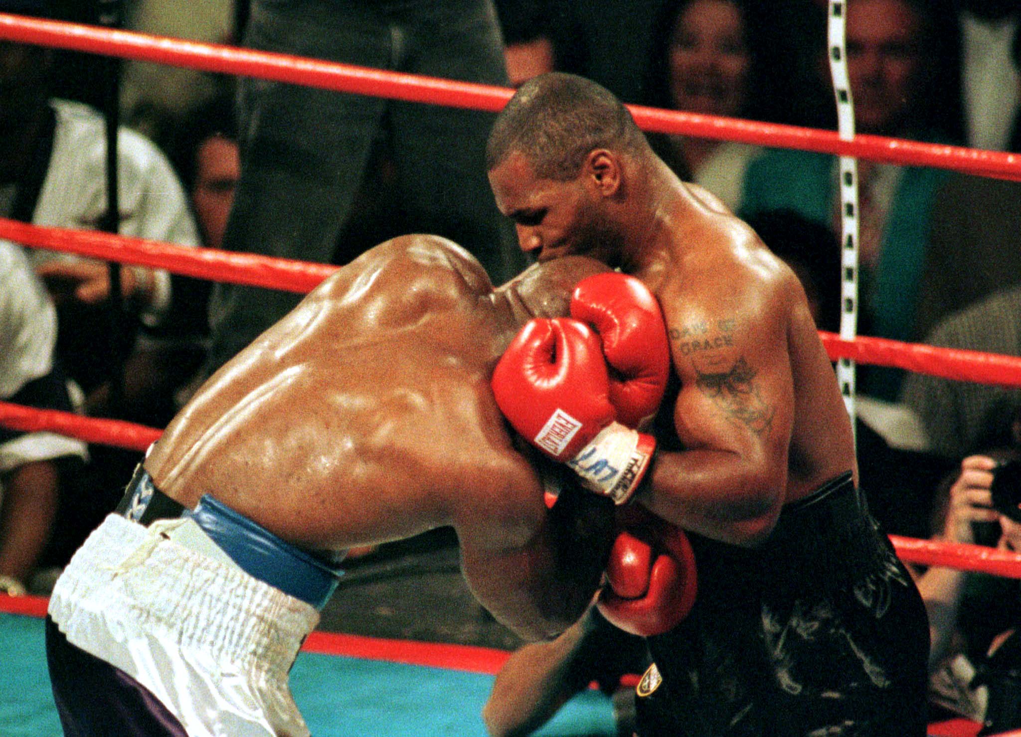 Tyson bites Holyfield's ear back in 1997 (©Focus on Sport/Getty Images))