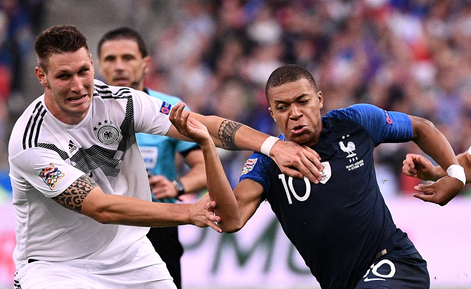 Here we go again: Niklas Sule of Germany goes against France's Kylian Mbappe (©AFP)