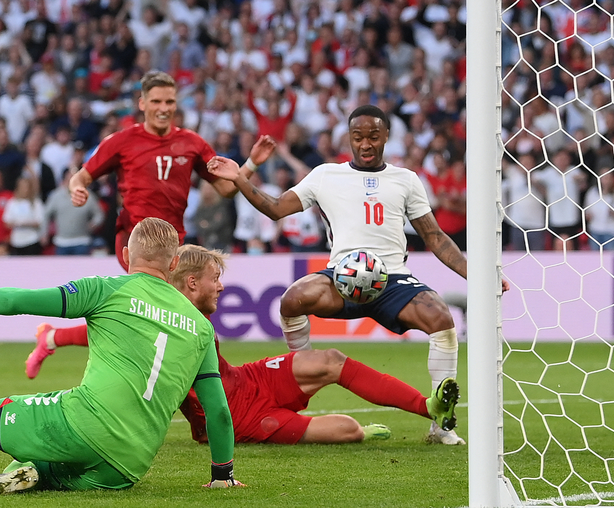 Simon Kjaer prevents Raheem Sterling from scoring a goal... by scoring an own goal (©AFP)