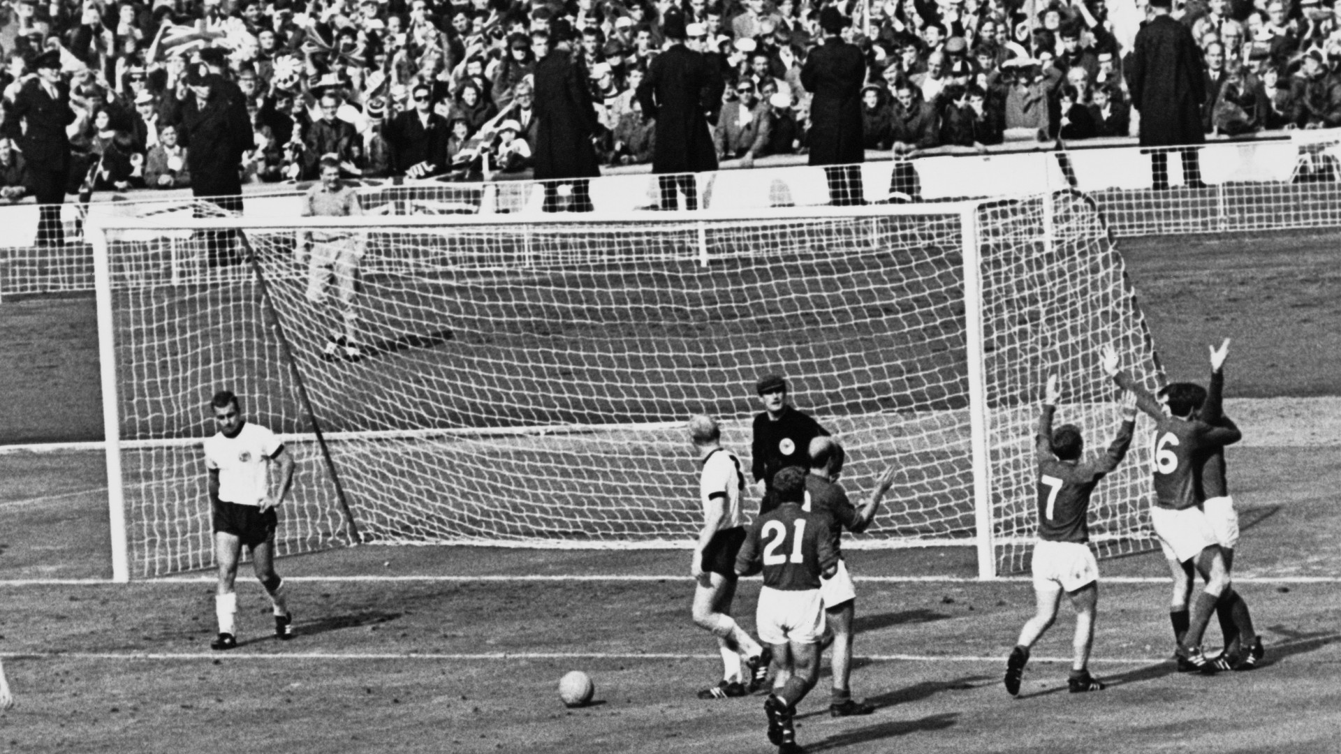 The England team celebrate after Geoff Hurst scores the controversial third goal against West Germany during the World Cup final at Wembley Stadium, 30th July 1966 (©Getty images)