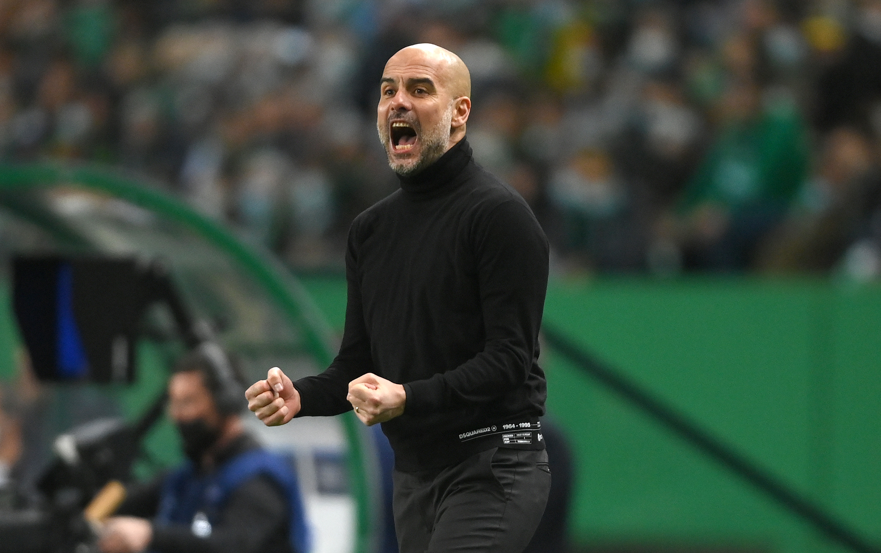 Pep Guardiola celebrates (©Mike Hewitt/Getty Images)