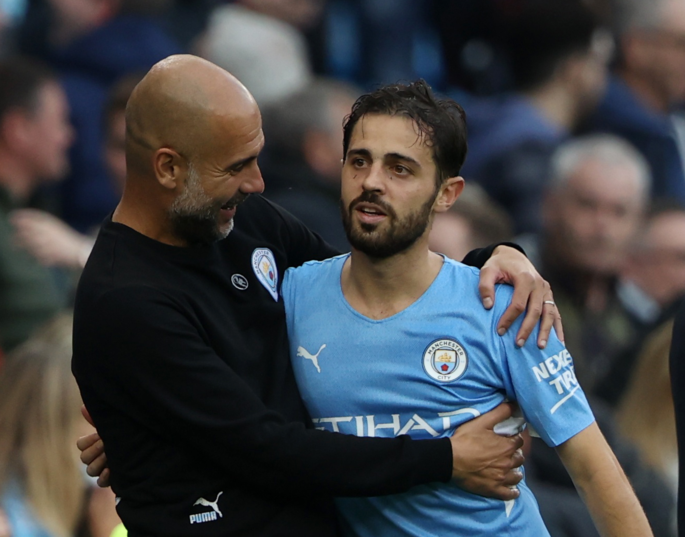 Guardiola hugs Bernardo Silva (©Action Images via Reuters/Molly Darlington)