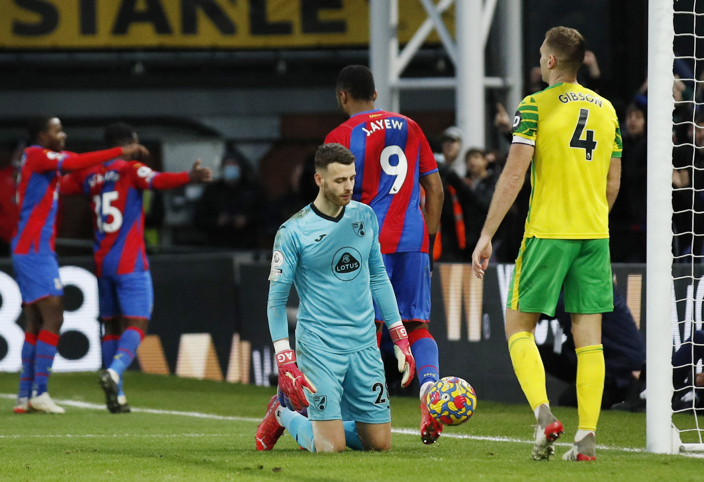 Down on their knees, while the opponents celebrate... (©Action Images via Reuters/Andrew Boyers)