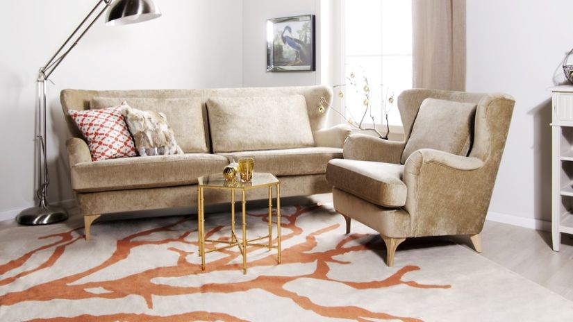 Fauteuil à oreilles en velours beige