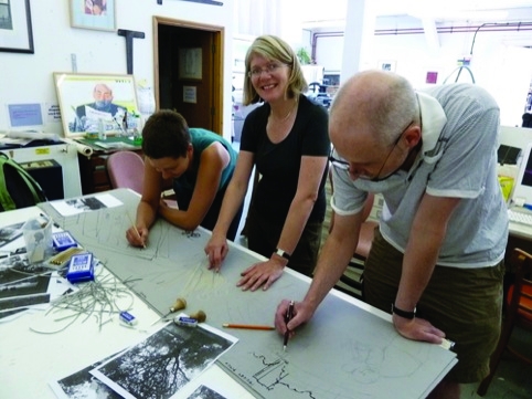 ELP members working on the giant lino print