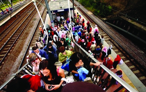 Visitors clad in Bedouin attire get off the overground