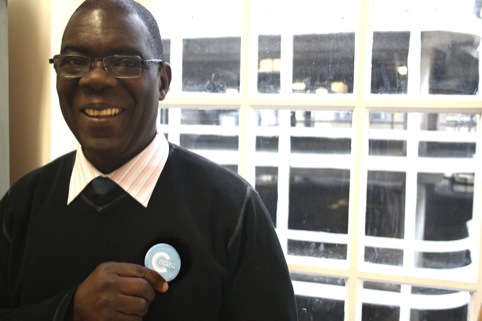 Cephas holding badge