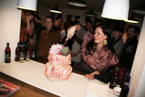 Amelia Gregory cutting her enormous Lilly Vanilli cake 