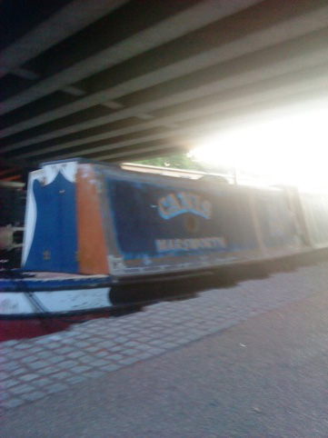 canal boat next to Folly for a Flyover