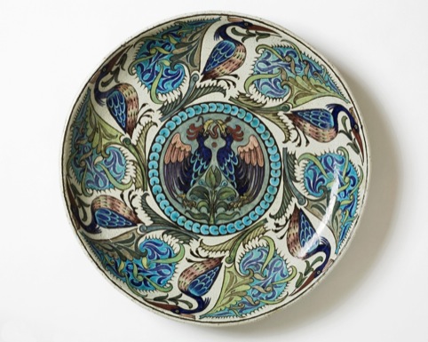 Large circular earthenware dish designed by William de Morgan thought to date from between 1888 and 1911