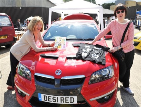 Lady Christina Blake and her daughter with a red car