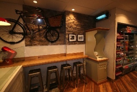 Greggs The Bakery's design features antiquaries referencing the shops beginnings