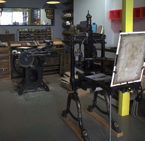 Unite Type's back room features three vintage letterpress machines