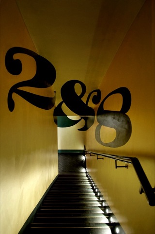 The branding shown as a trompe l'oeil descending the stairs