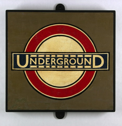 Underground roundel from Westminster Station, c.1930. By Edward Johnston