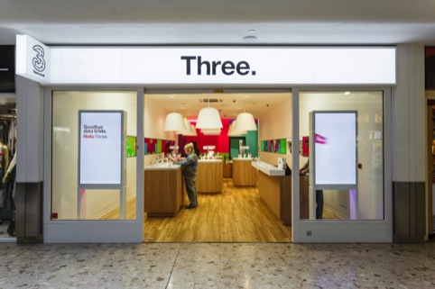 Front of the store with new 'Three.' fascia and signage