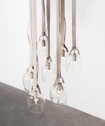 Bells-lights: Discarded Fendi leather, glass, leather-covered hooks, leather-covered electric wire. 