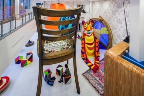 Stotytelling takes place under the giant chair in the Activity Space