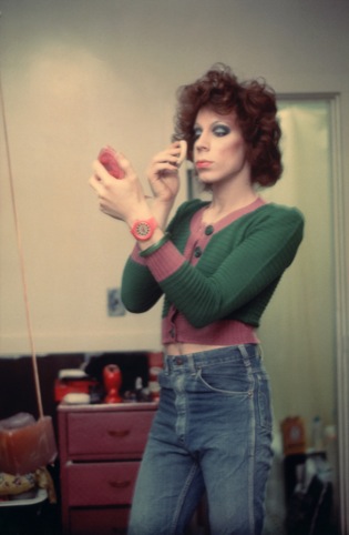 Nan Goldin, Kenny putting on make up, Boston 1973