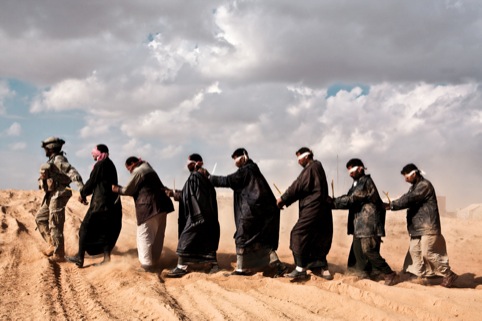 US Marines taking detainees in for questioning. Suspected insurgents were captured during Operation ‘Steel Curtain’, which aimed to break insurgent cells located on the Syrian border.